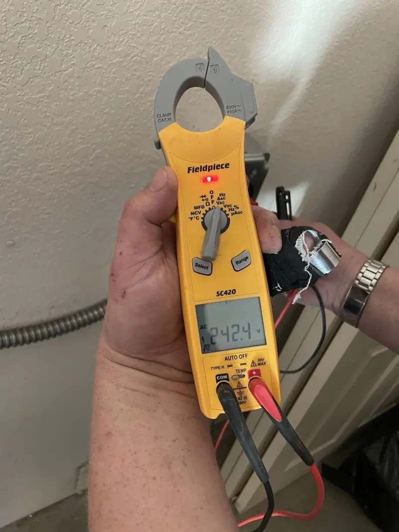 Voltage testing with clamp meter during Generator Installation in Townsend
